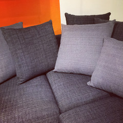 Gray sofa with lots of cushions