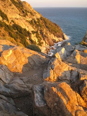 Fototapeta na wymiar Isola d'Elba mare,roccia,natura e tramonti