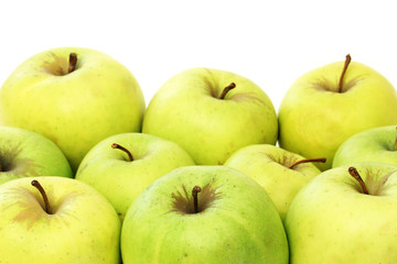 A lot of green apples on a white background