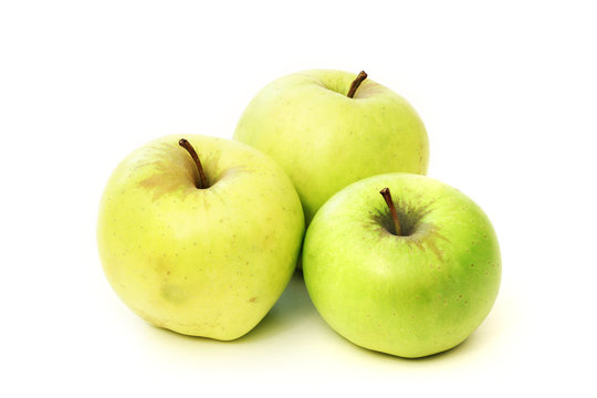 Three green apple on a white background