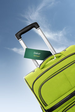 Dakar, Senegal. Green suitcase with label