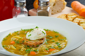 Beef broth with toast and egg benedict