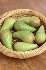 Few pears in a basket.