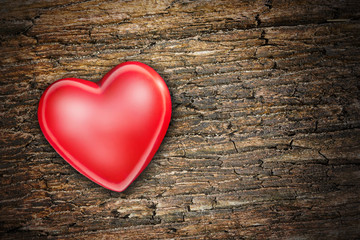 red heart on old shabby wooden background
