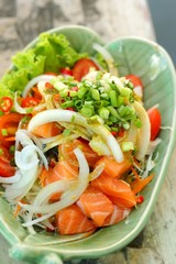 Fresh salmon salad with spices - Japanese food.