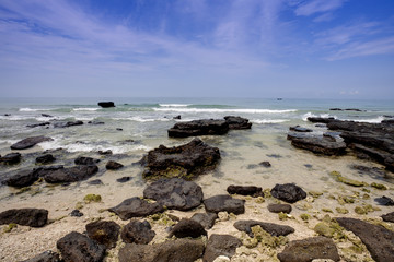 Tropical seascape - rocks , sea and blue sky