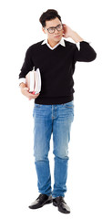 Full length portrait of  young man holding books