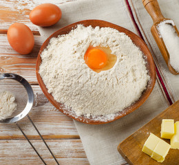 Baking ingredients - eggs, flour,  butter and sugar