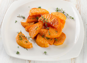 Baked sweet potato wedges with herbs