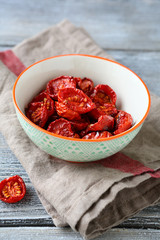 Sun-dried tomatoes in a bowl on napkin