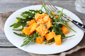 Salad with arugula and pumpkin
