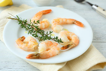 Shrimp and thyme on plate