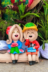 Boy and Girl Clay dolls for garden decoration