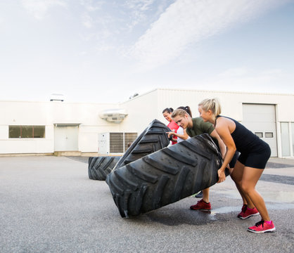 Athletes Flipping Tires - Powered by Adobe