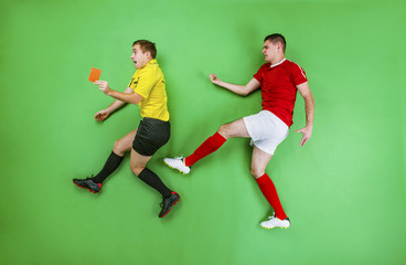 Fototapeta na wymiar Football player and referee