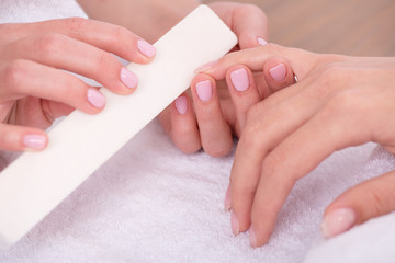 client and manicurist in manicure salon