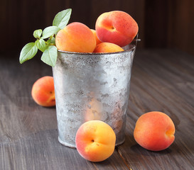 Juicy fresh peaches in a bucket