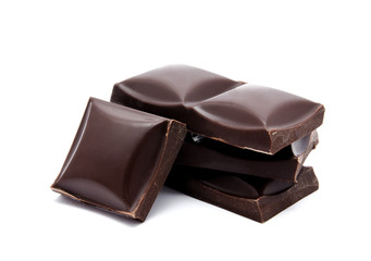 Dark chocolate bars stack with crumbs isolated