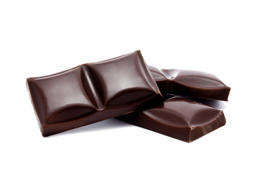 Dark chocolate bars stack with crumbs isolated