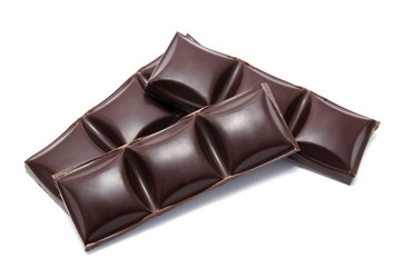 Dark chocolate bars stack with crumbs isolated