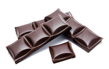 Dark chocolate bars stack with crumbs isolated