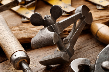 old clamp on aged work-table