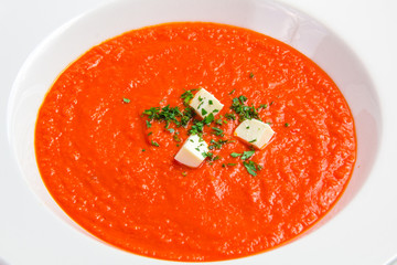 Tomato soup with herbs and cheese