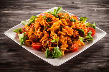 Pasta with meat, tomato sauce and vegetables