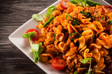 Pasta with meat, tomato sauce and vegetables