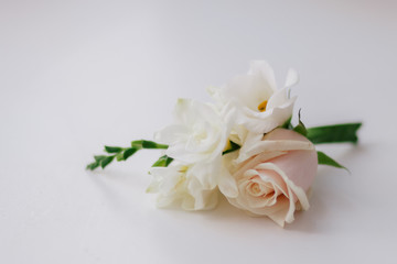 groom's boutonniere with roses