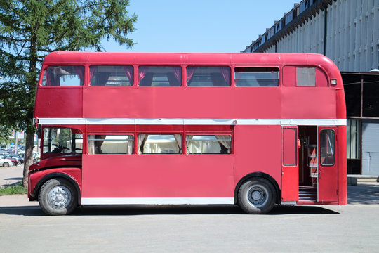 Old double-decker bus at street