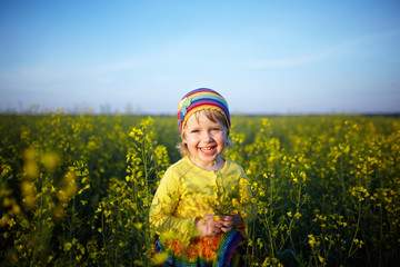 Fototapeta premium little happy girl on the meadow