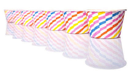 Obraz premium Cupcake paper baking cups over white background 