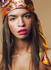 beauty young afro american woman in shawl on head smiling close
