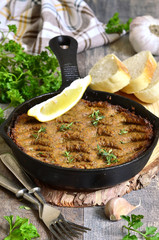 Pate from beef liver and vegetables baked in frying pan.