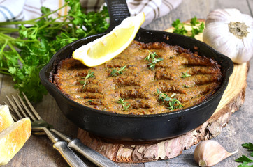 Pate from beef liver and vegetables baked in frying pan.