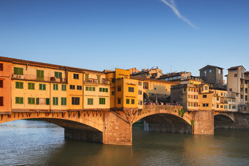 Fototapeta na wymiar Bridge Ponte Vecchio on Arno River in the evening, Florence, Ita