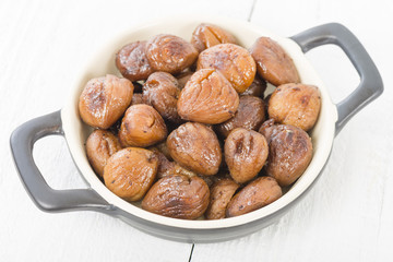 Chestnuts - Peeled and cooked chestnuts on a white background.