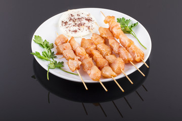 Raw Chicken Skewers On Plate
