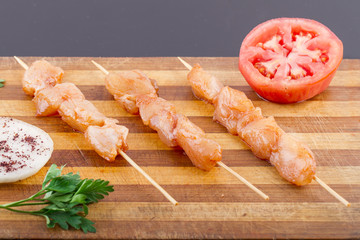 Raw Chicken Skewers On Plate
