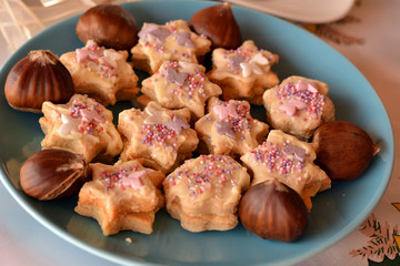 Christmas cookies stars decorated  on the blue  plate
