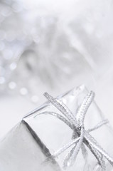 Silver gift box on white blur background