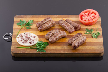 inegol Meatball on a wood plate