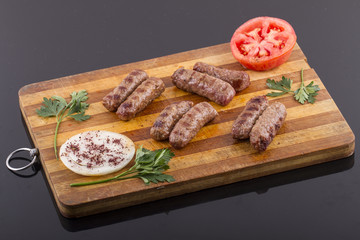 inegol Meatball on a wood plate
