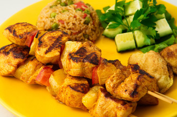 The chicken kebab on skewers with vegetables