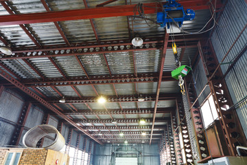 hoist with overhead crane and scales in warehouse