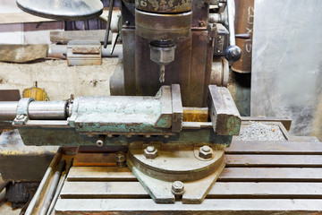 vice and drill of old boring machine close up