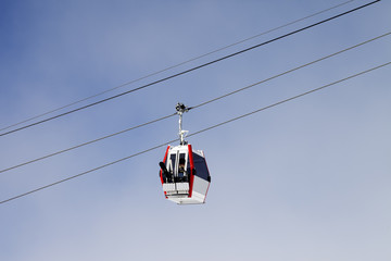 Gondola lift with ski and snowboards