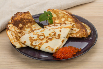 Pancakes with red caviar