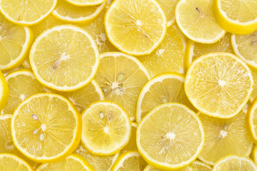 background of sliced ripe lemons organic, pattern